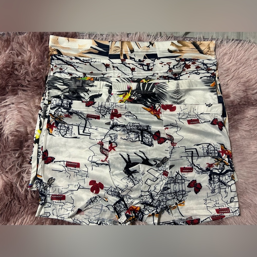 002 INTMTS: 4 piece printed men's boxer briefs size L
